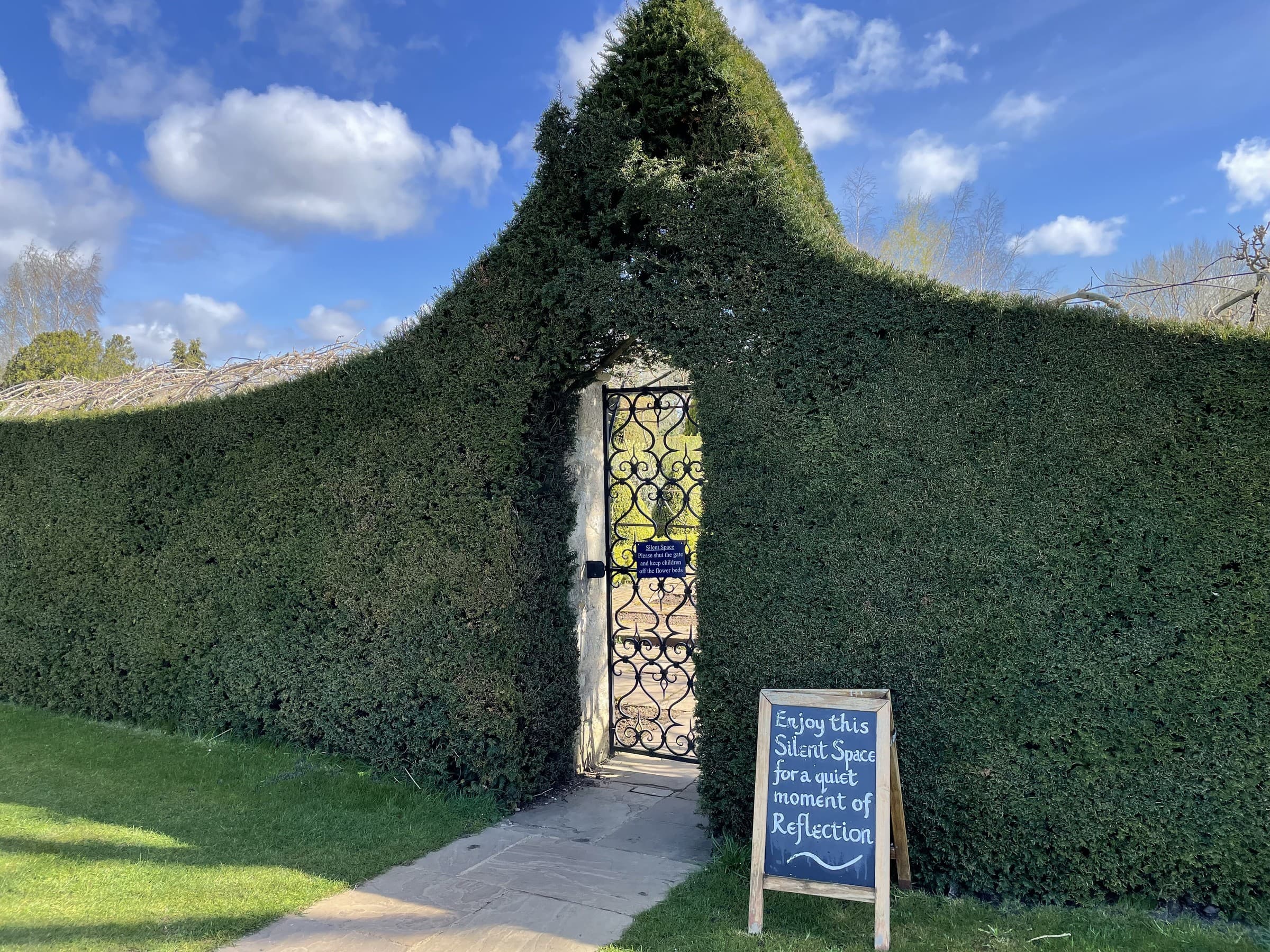 A garden gateway opening onto the grounds at Waterperry House